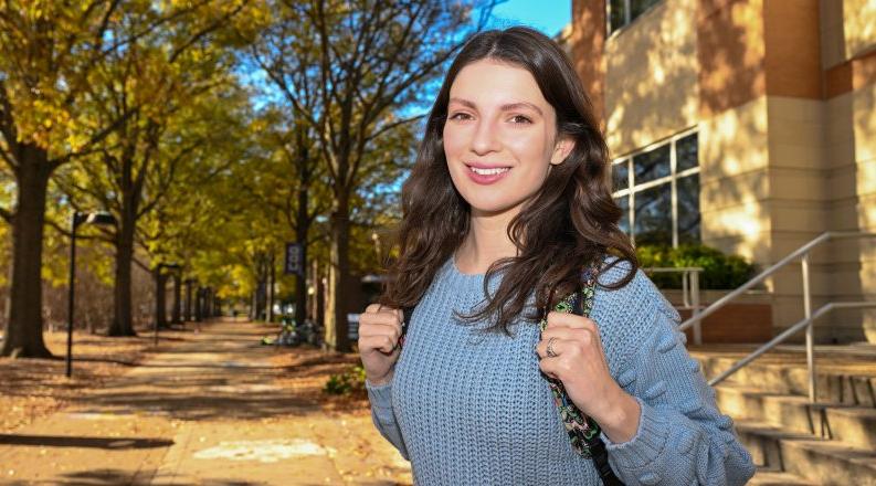 A woman stands on ODU’s campus.